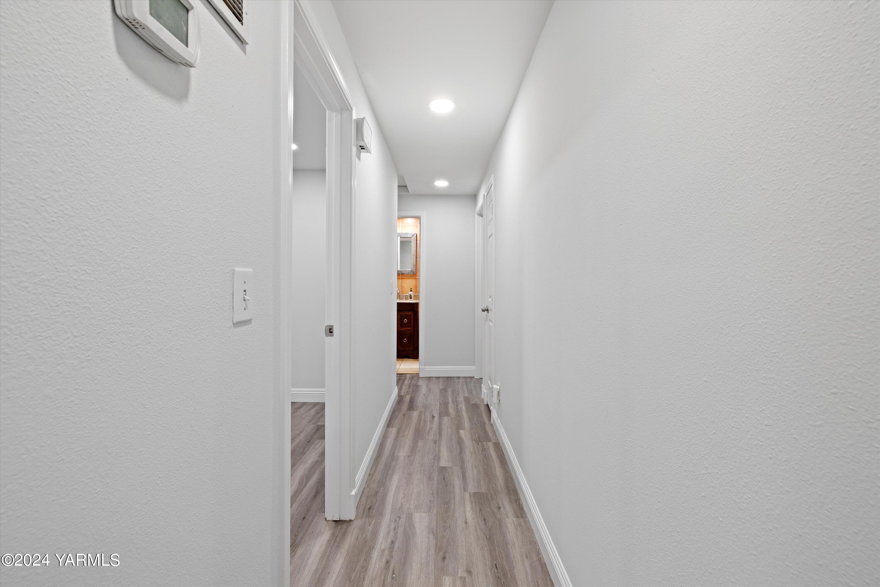 1511 Progressive Road Wapato, WA 98951 - Photo 8 of 36 a view of a hallway with wooden floor