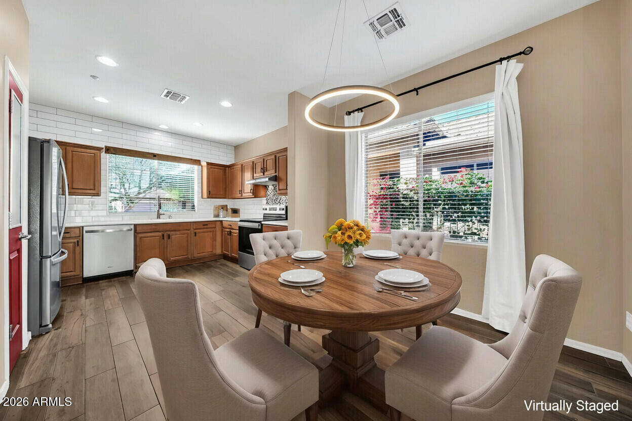 1834 West Owens Way Anthem, AZ 85086 - Photo 9 of 51 9 Dining Area Virtually Staged - 1834 W
