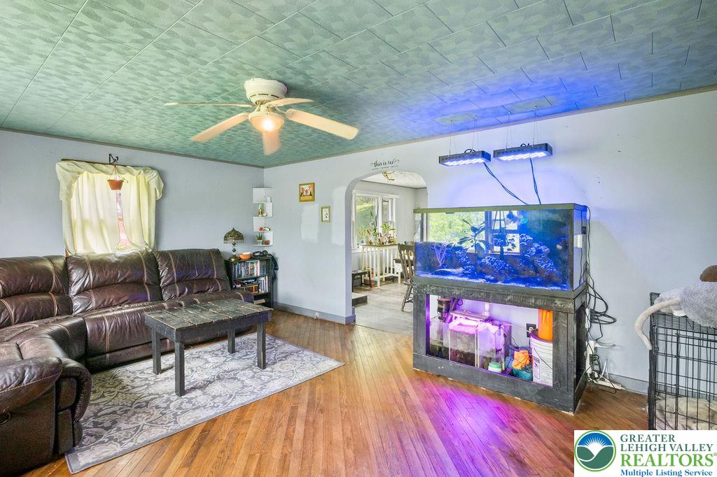 1644 Moselem Spring Road Hamburg, PA 19526 - Photo 7 of 24 a living room with furniture and a fireplace