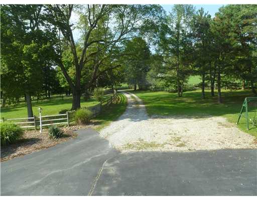 140 South Spring Valley Road Canonsburg, PA 15317 - Photo 11 of 18 Exterior Front. Driveway access from property to road. Fenced area to left the back yard of the only neighbor you can see. You are 2 miles to Route 19 and Peter s business area yet you can walk to Peters Lake and Trail.!