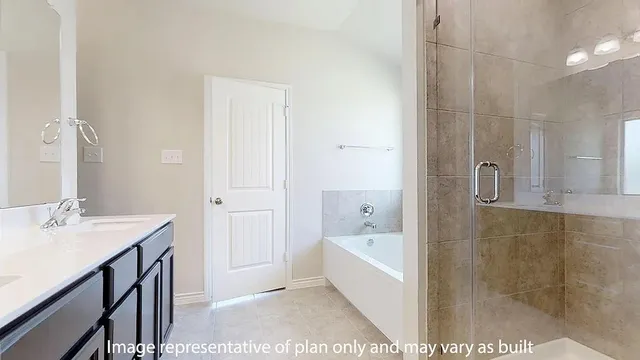 a bathroom with a tub sink and mirror
