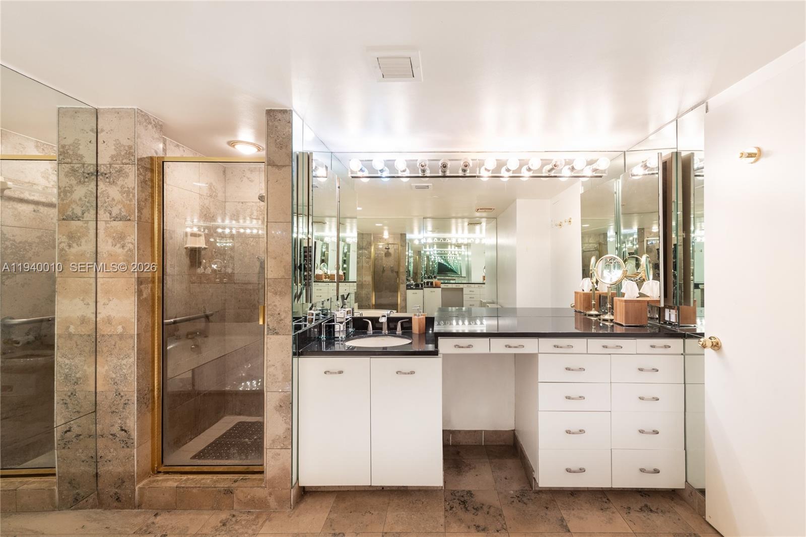 4000 Towerside Terrace, Unit 805 Miami, FL 33138 - Photo 12 of 18 a bathroom with a double vanity sink and a mirror