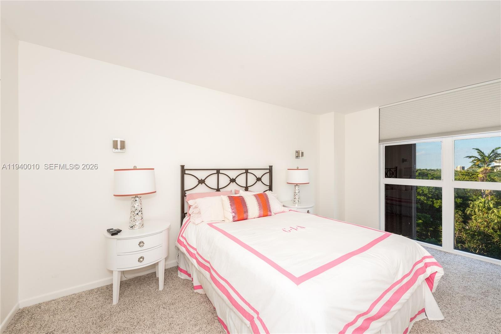 4000 Towerside Terrace, Unit 805 Miami, FL 33138 - Photo 13 of 18 a bedroom with a bed and a large window