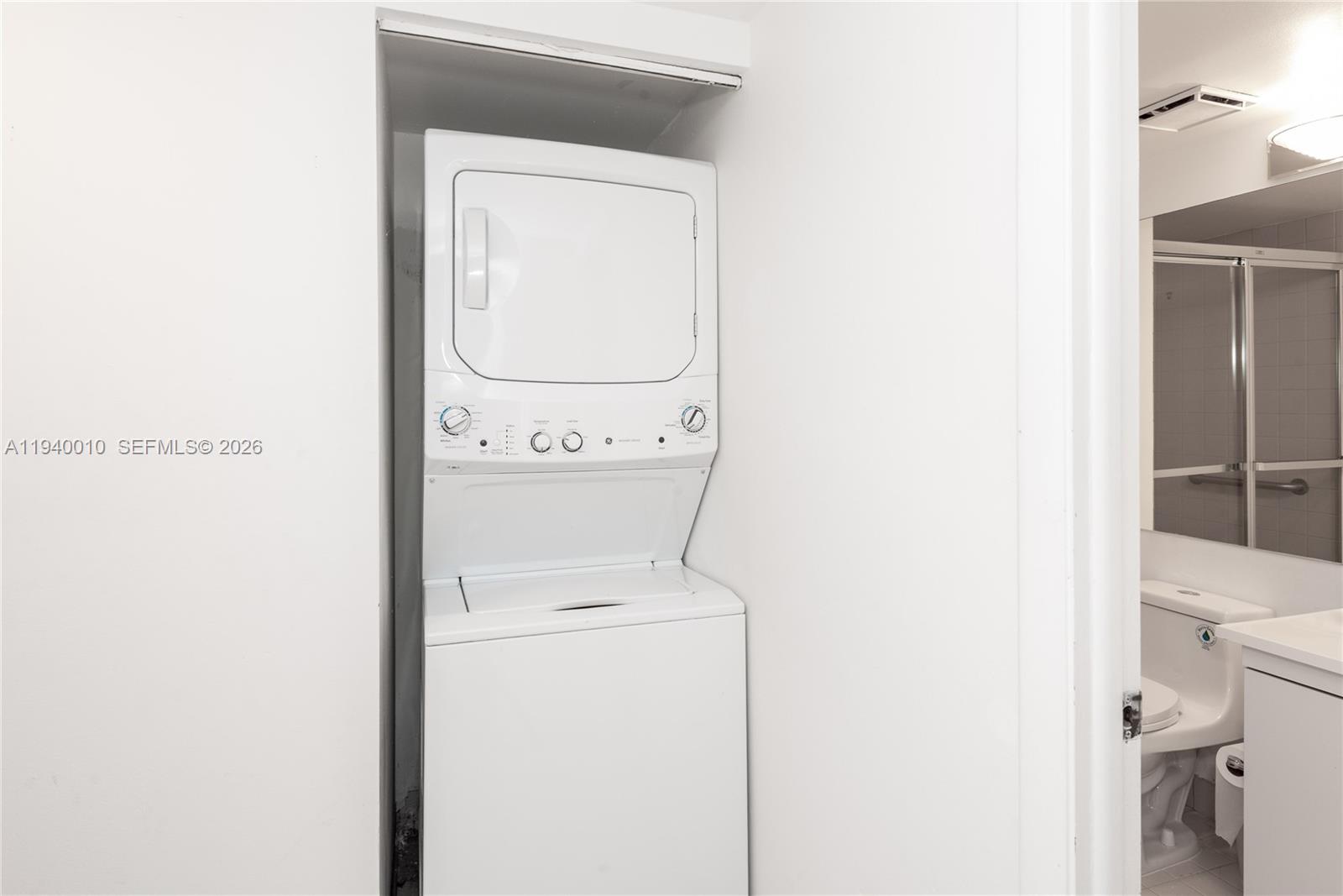 4000 Towerside Terrace, Unit 805 Miami, FL 33138 - Photo 14 of 18 a utility room with dryer and washer