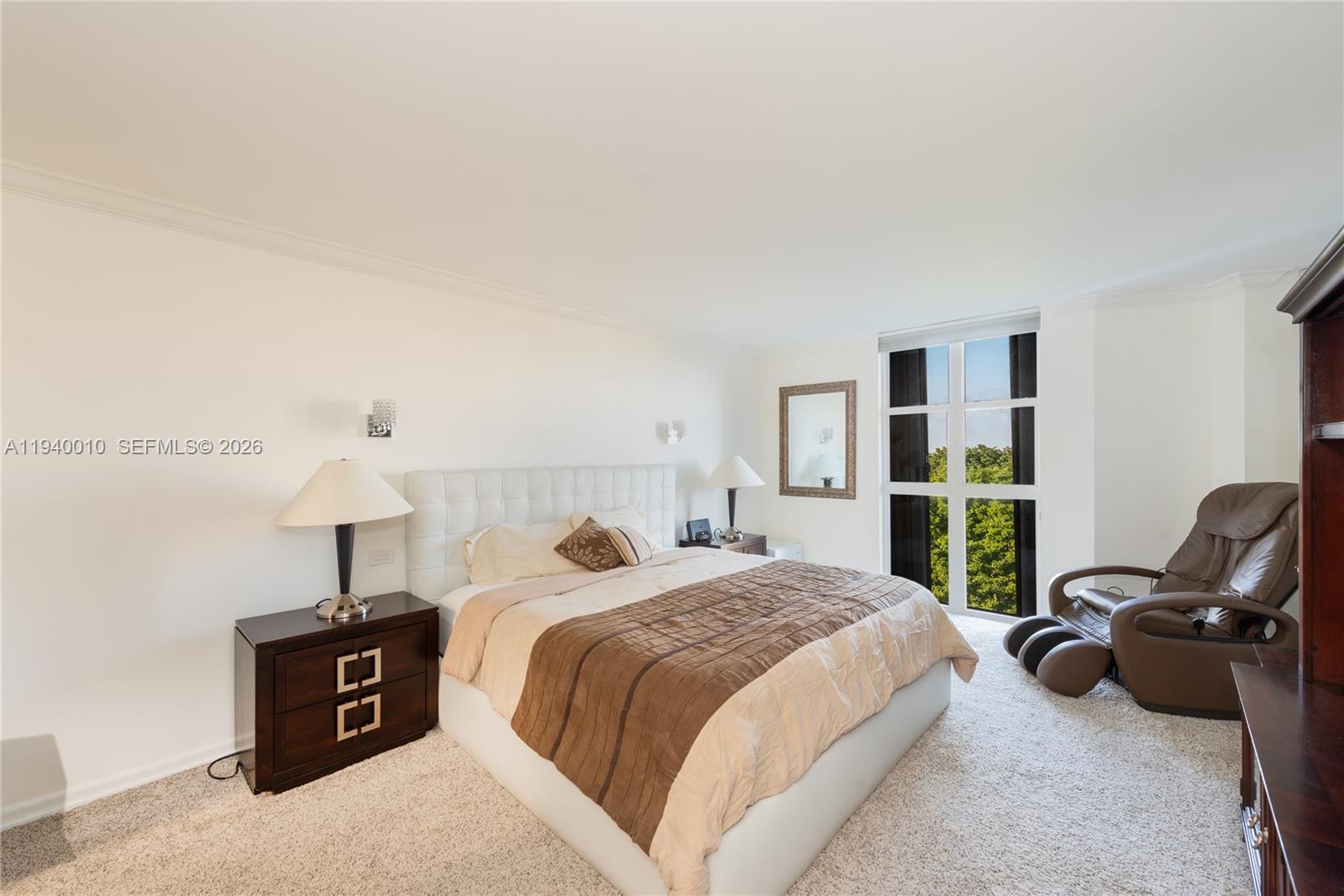 4000 Towerside Terrace, Unit 805 Miami, FL 33138 - Photo 10 of 18 a bedroom with a bed and furniture