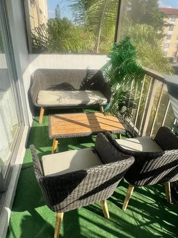 a view of outdoor sitting area with chairs