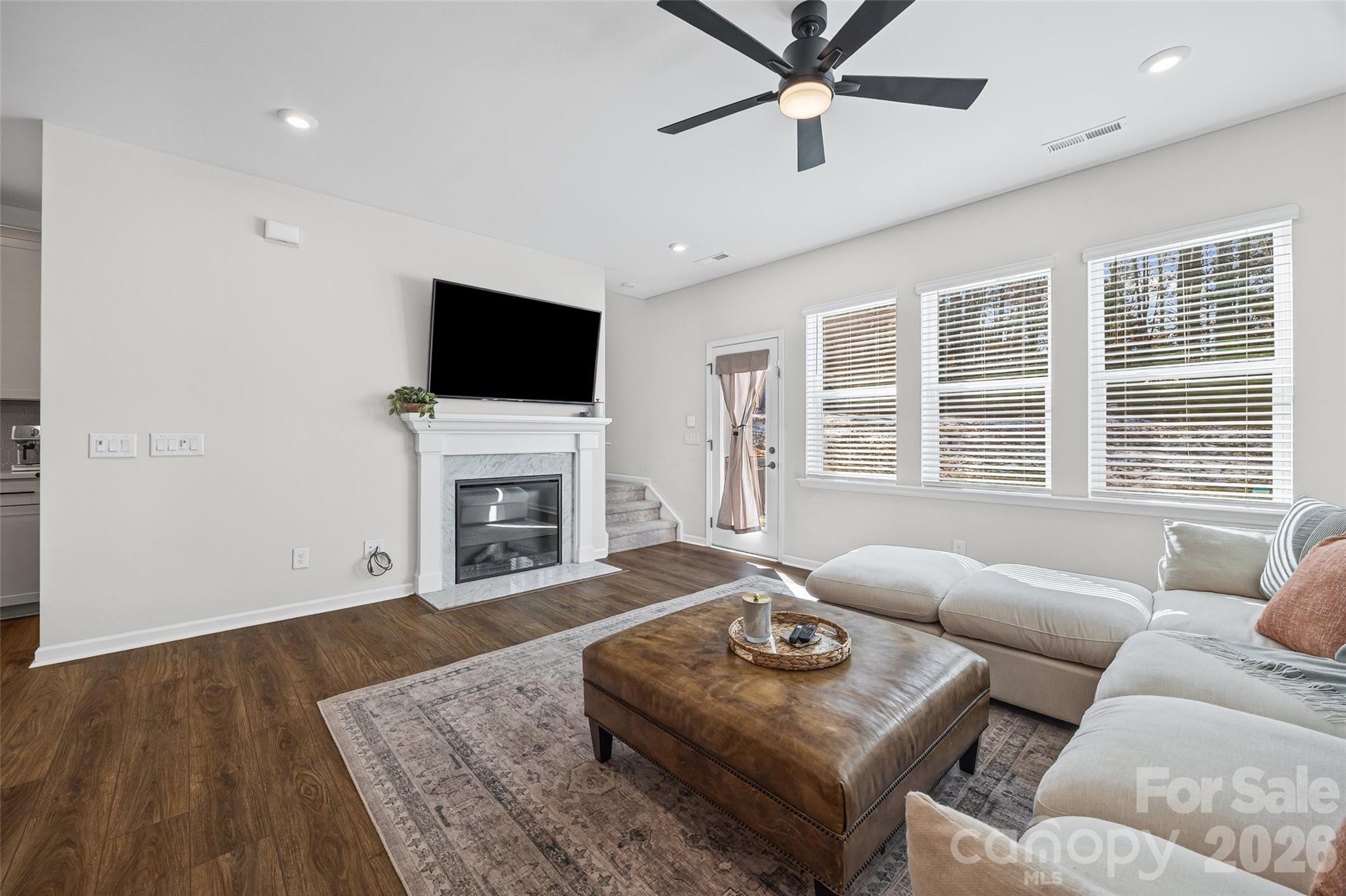 285 Brooks Springs Drive Fort Mill, SC 29708 - Photo 13 of 28 a living room with furniture a fireplace and a flat screen tv