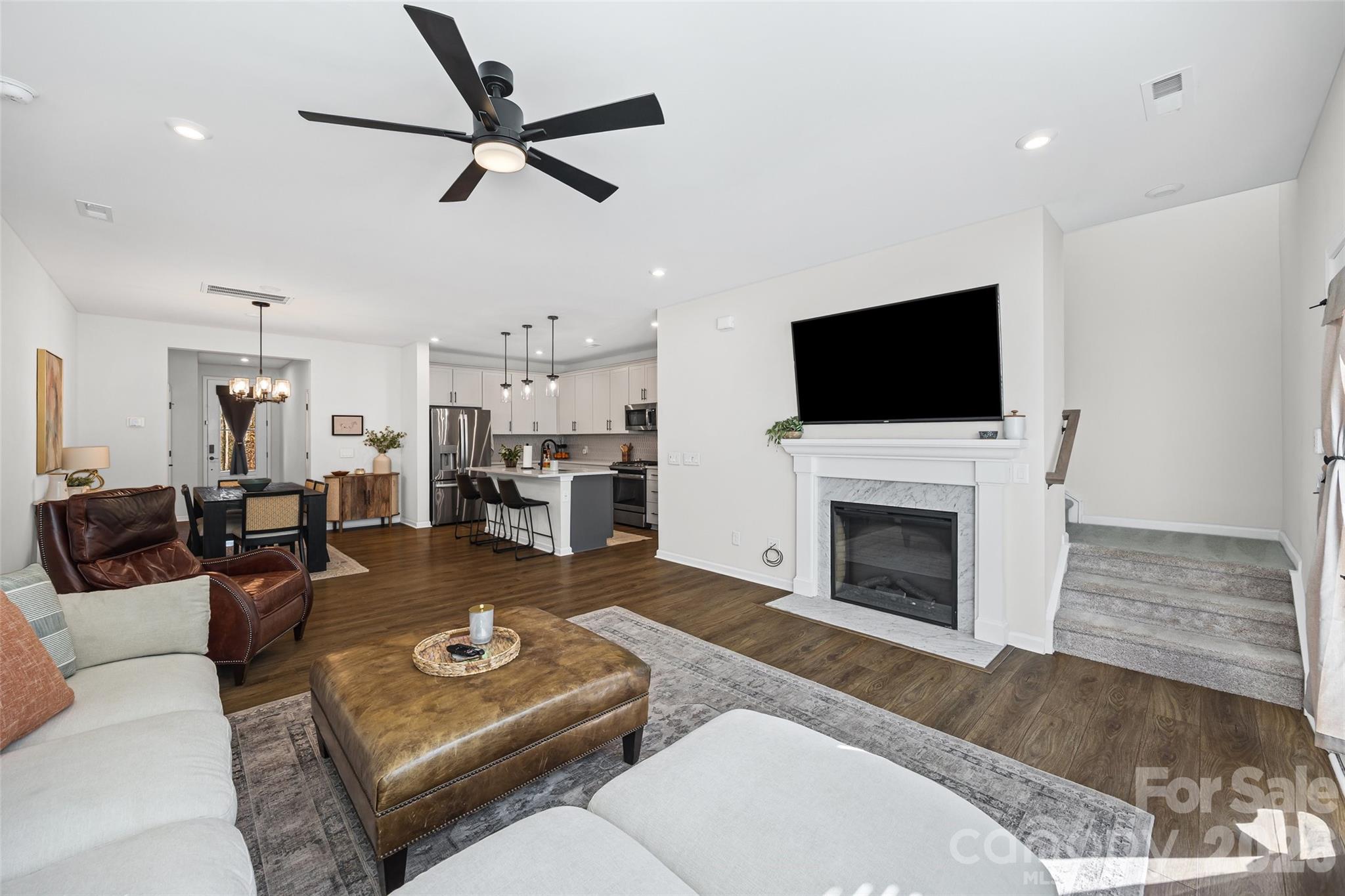 285 Brooks Springs Drive Fort Mill, SC 29708 - Photo 15 of 28 a living room with furniture a fireplace and a flat screen tv