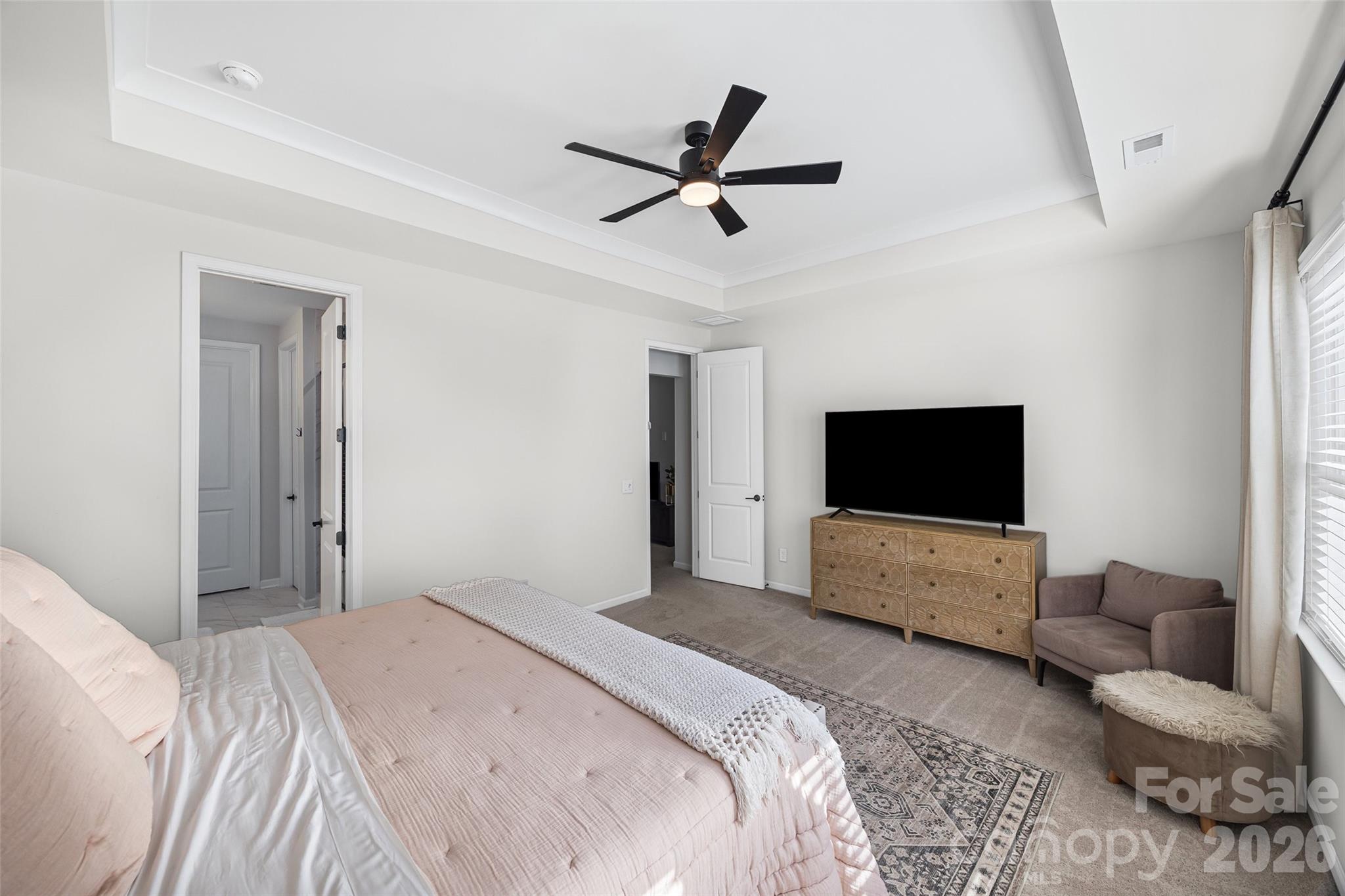 285 Brooks Springs Drive Fort Mill, SC 29708 - Photo 16 of 28 a bedroom with a bed and a flat screen tv