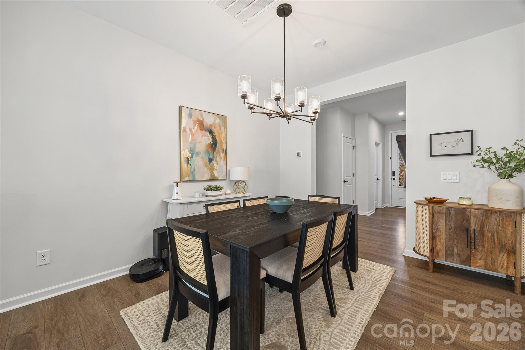 285 Brooks Springs Drive Fort Mill, SC 29708 - Photo 7 of 28 a view of a dining room with furniture and wooden floor