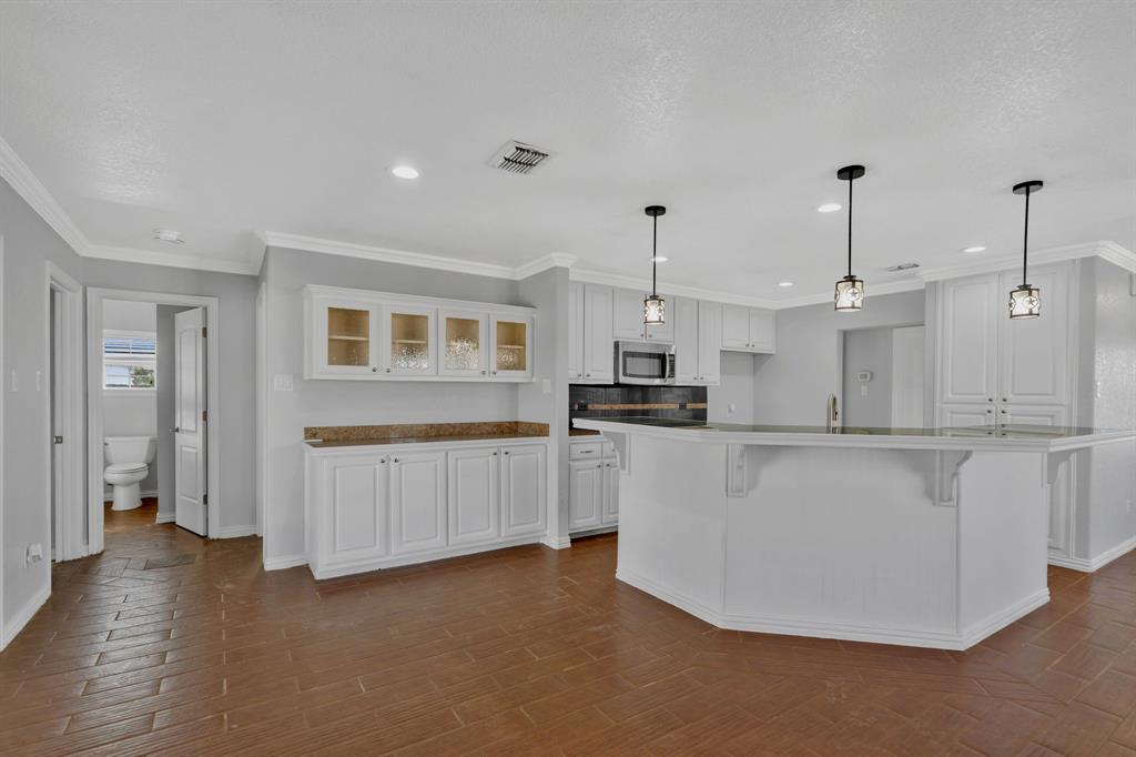 319 Hawk Ridge Decatur, TX 76234 - Photo 11 of 38 a kitchen with white cabinets and window