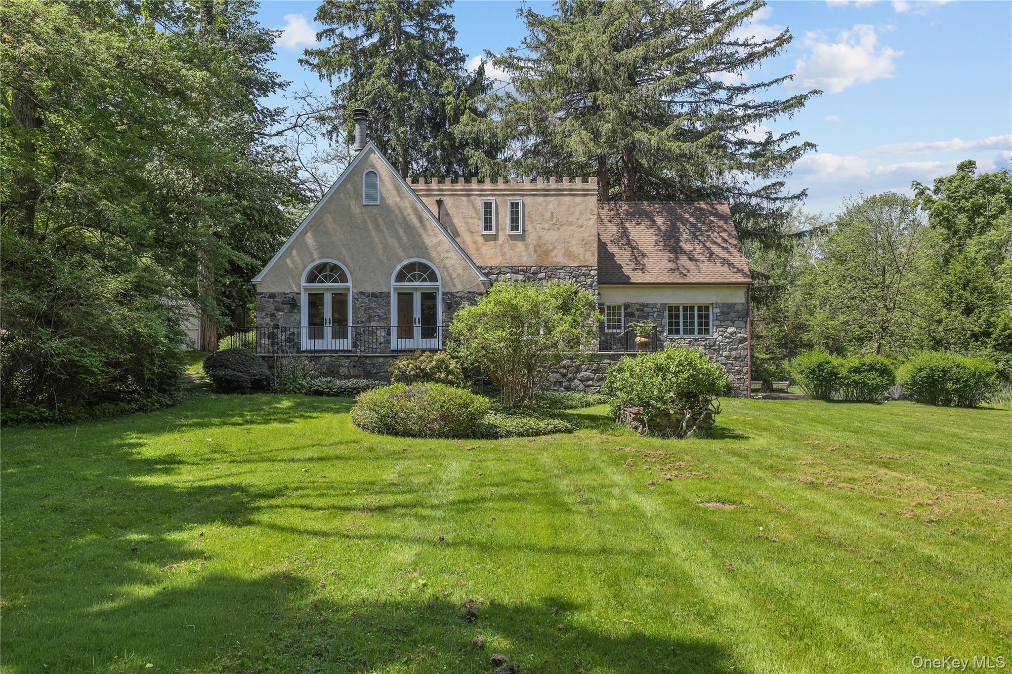 160 Long Ridge Road Bedford, NY 10506 - Photo 21 of 25 a front view of a house with a yard and trees