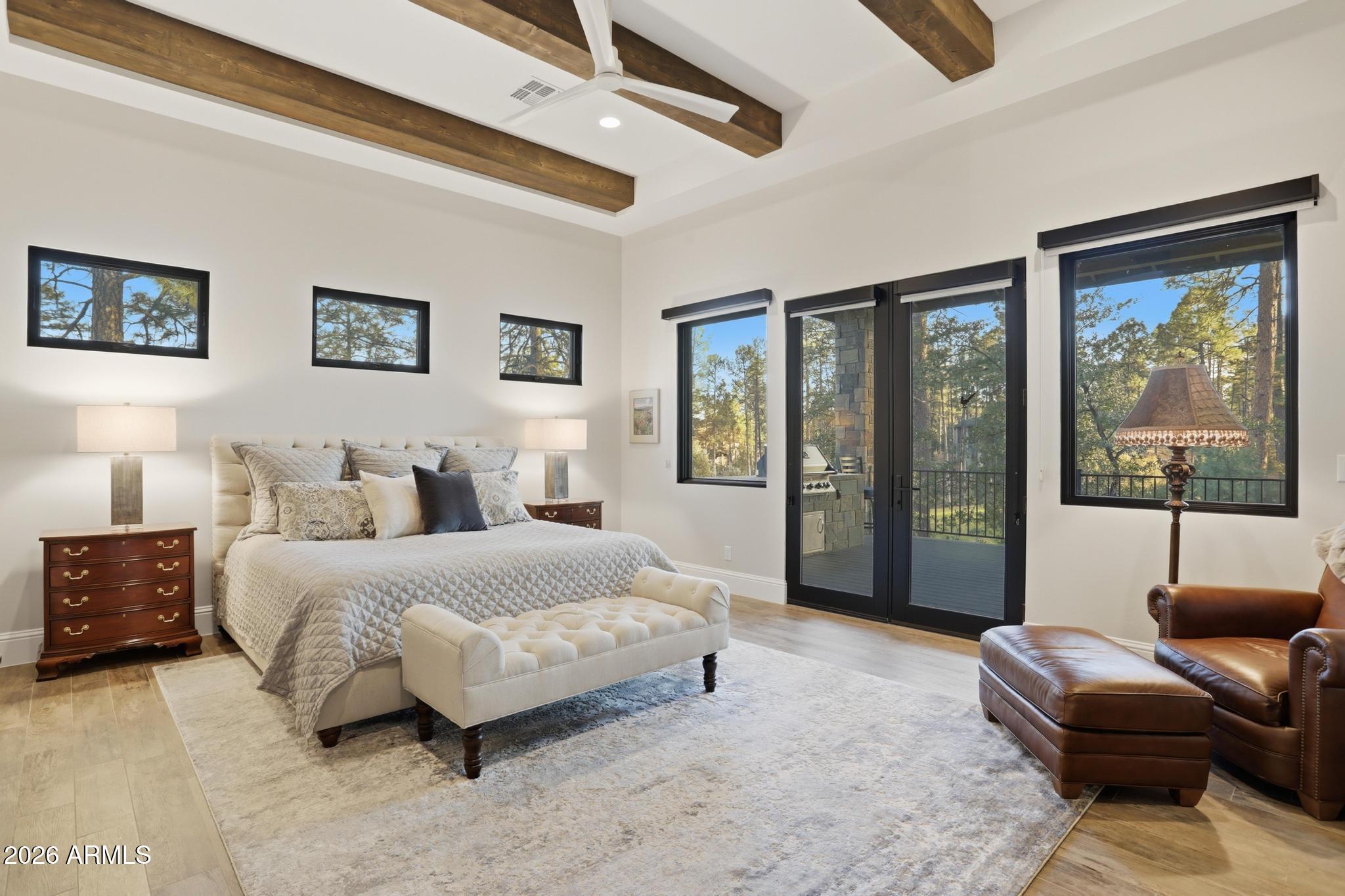 2207 East Filaree Circle Payson, AZ 85541 - Photo 12 of 38 a spacious bedroom with a bed couch and a large window