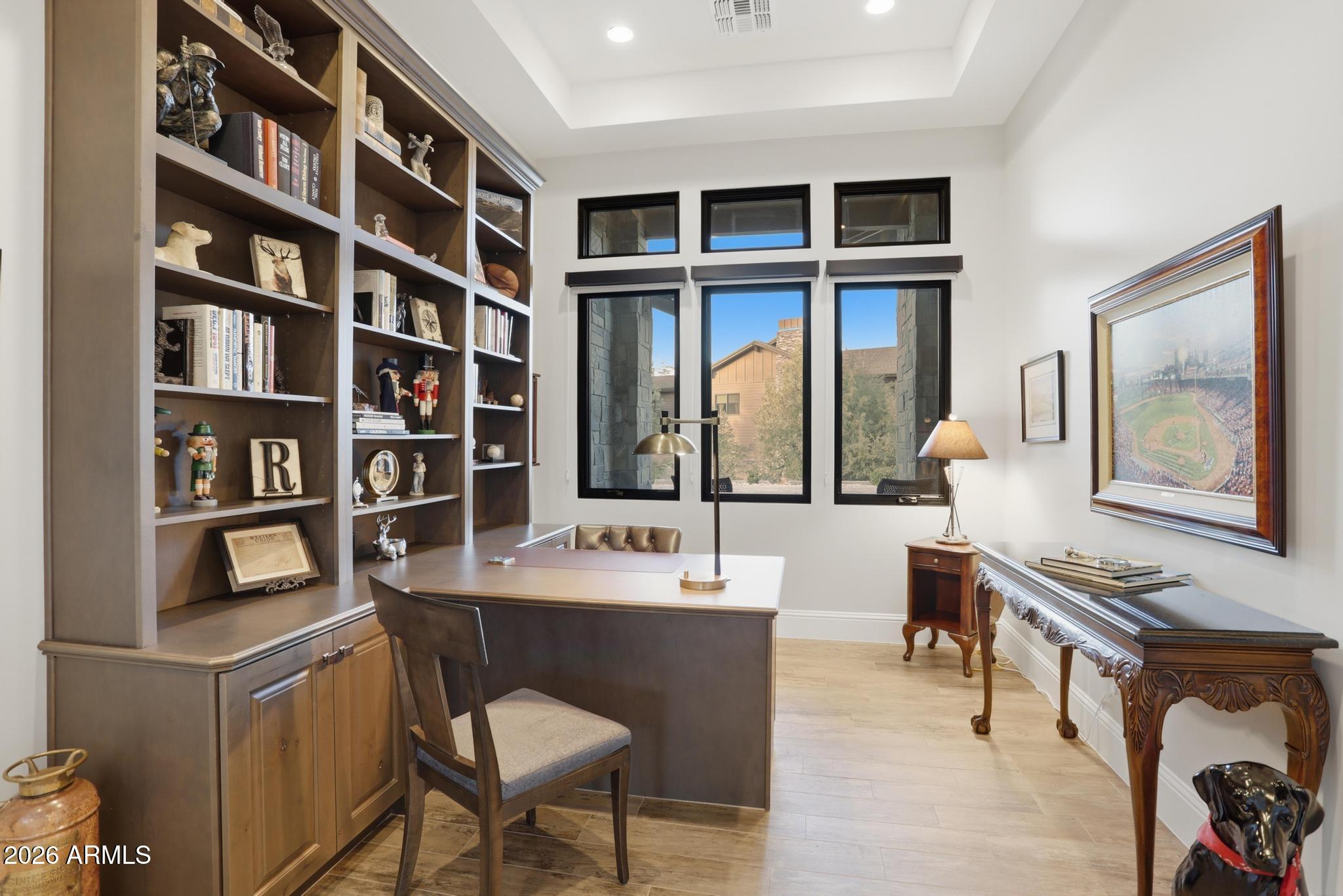 2207 East Filaree Circle Payson, AZ 85541 - Photo 17 of 38 a dining room with a bookshelf and a bookshelf