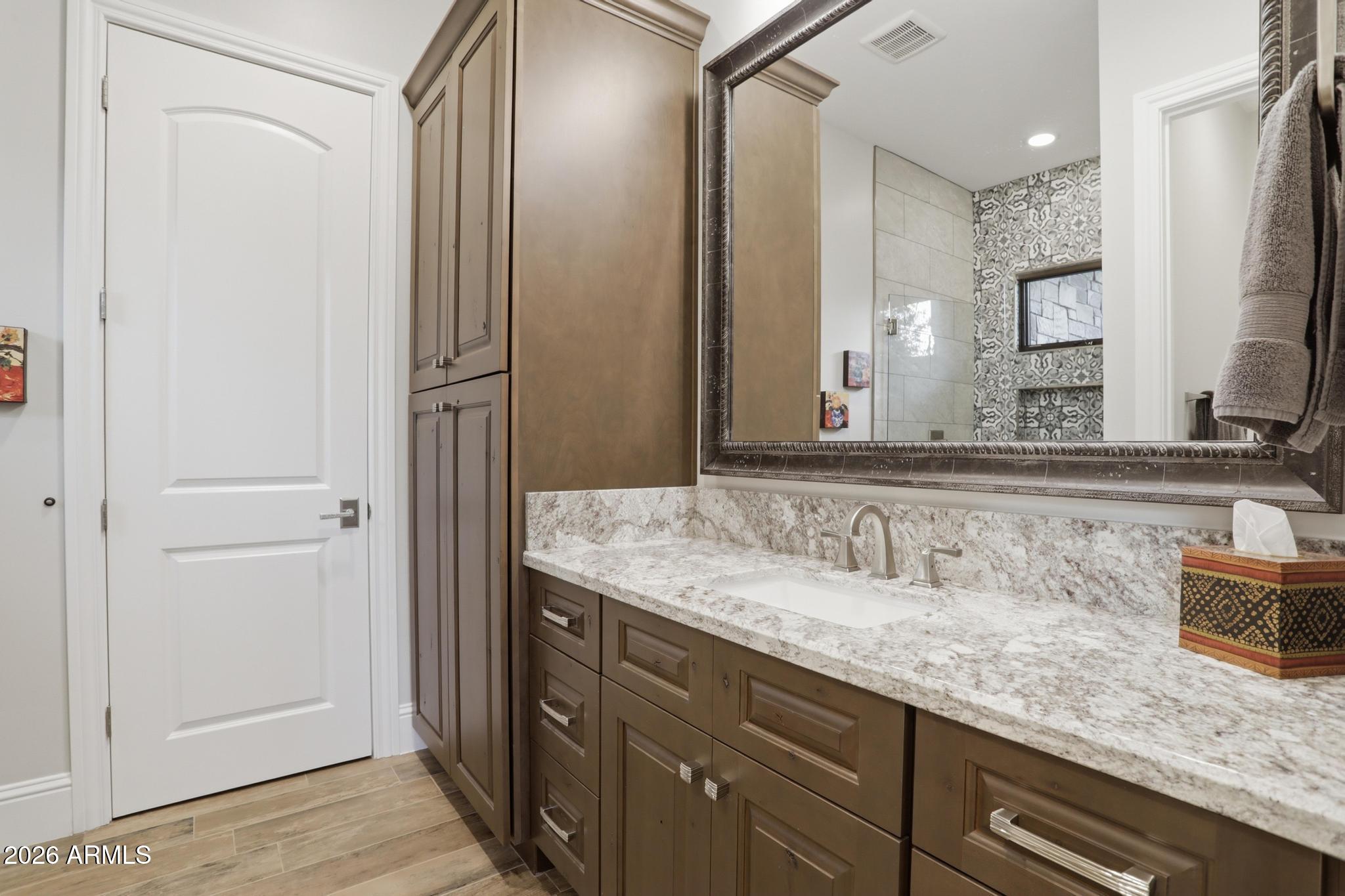 2207 East Filaree Circle Payson, AZ 85541 - Photo 20 of 38 a bathroom with a granite countertop sink and a mirror