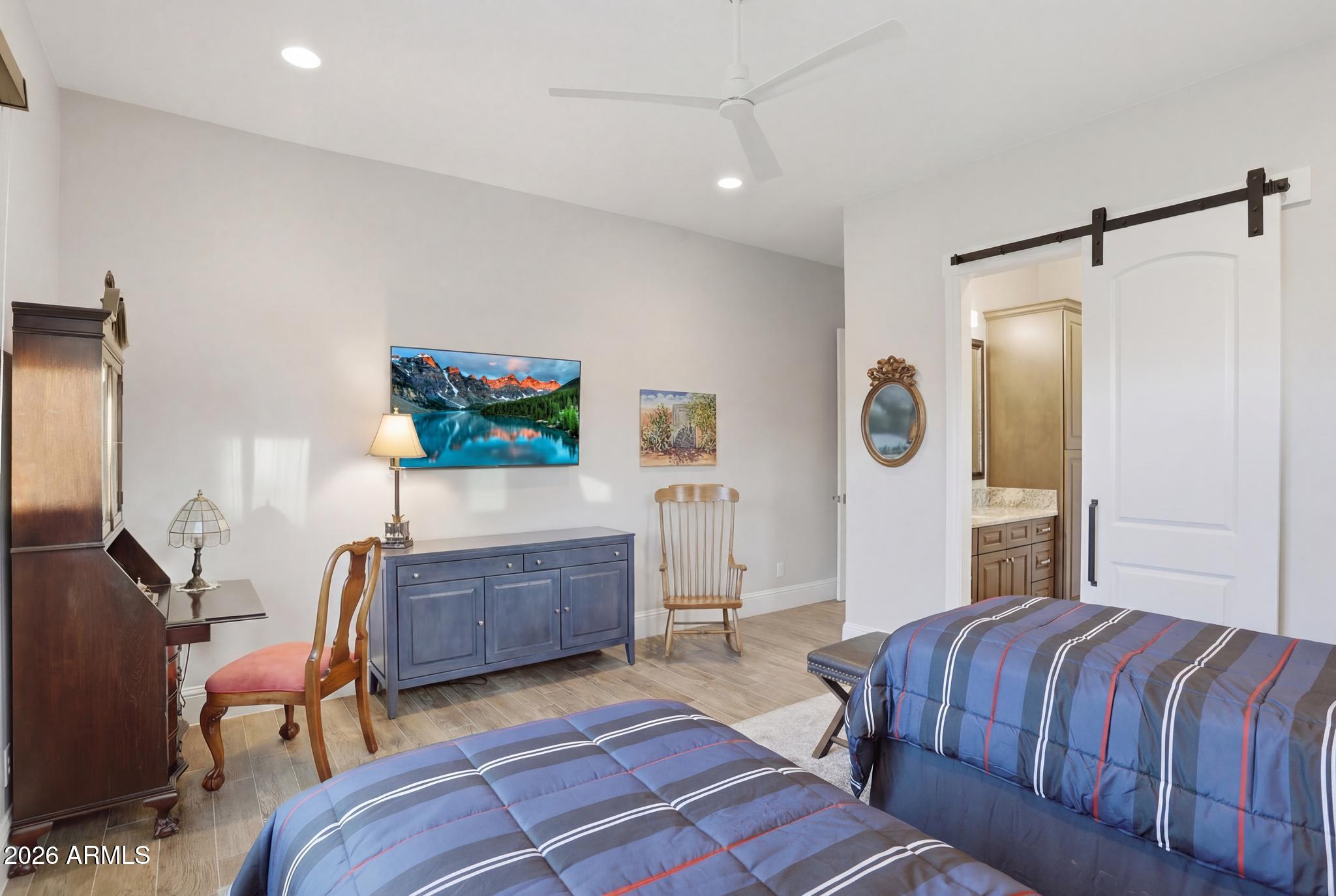 2207 East Filaree Circle Payson, AZ 85541 - Photo 23 of 38 a living room with a bed furniture and a flat screen tv