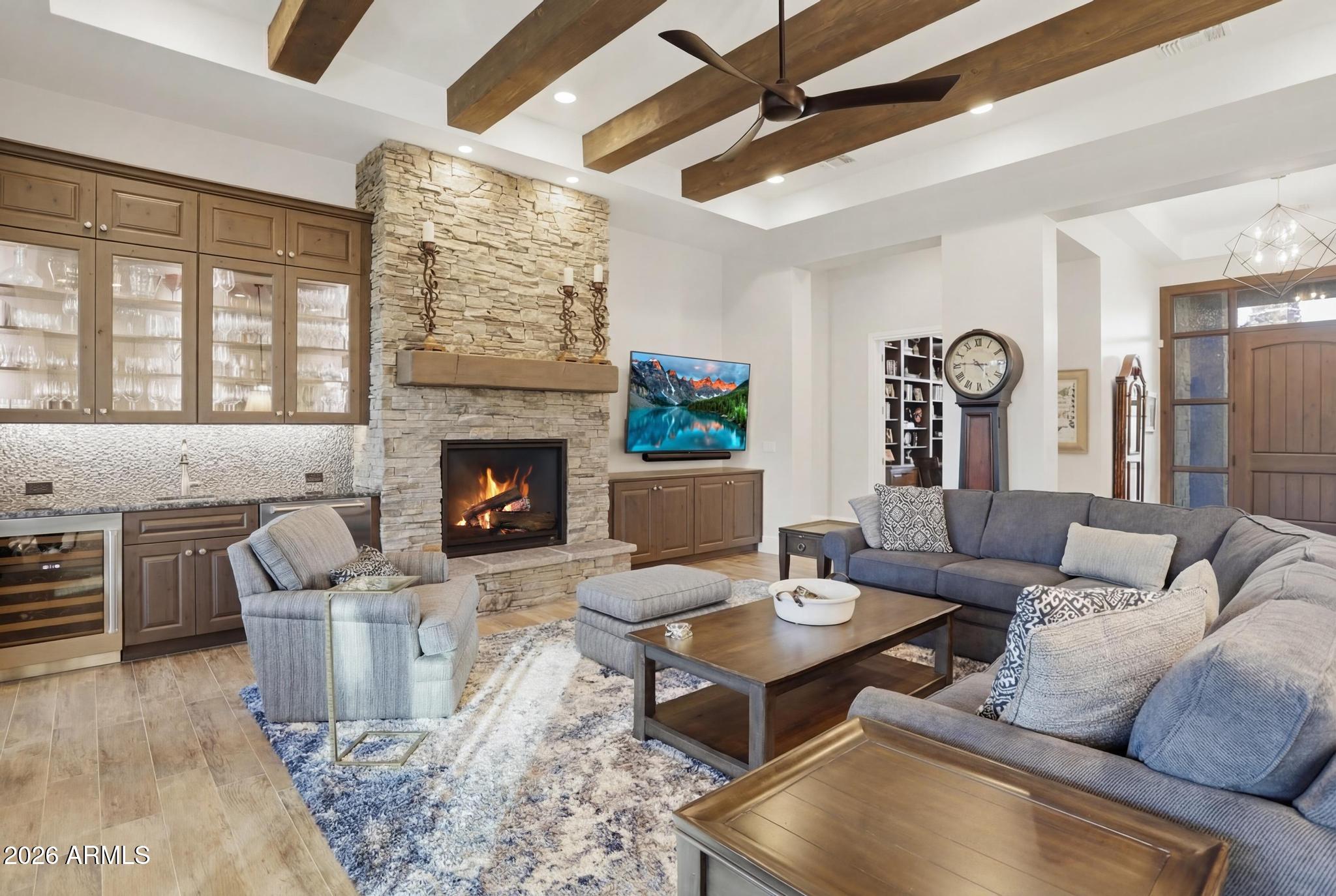 2207 East Filaree Circle Payson, AZ 85541 - Photo 3 of 38 a living room with furniture a fireplace and a table