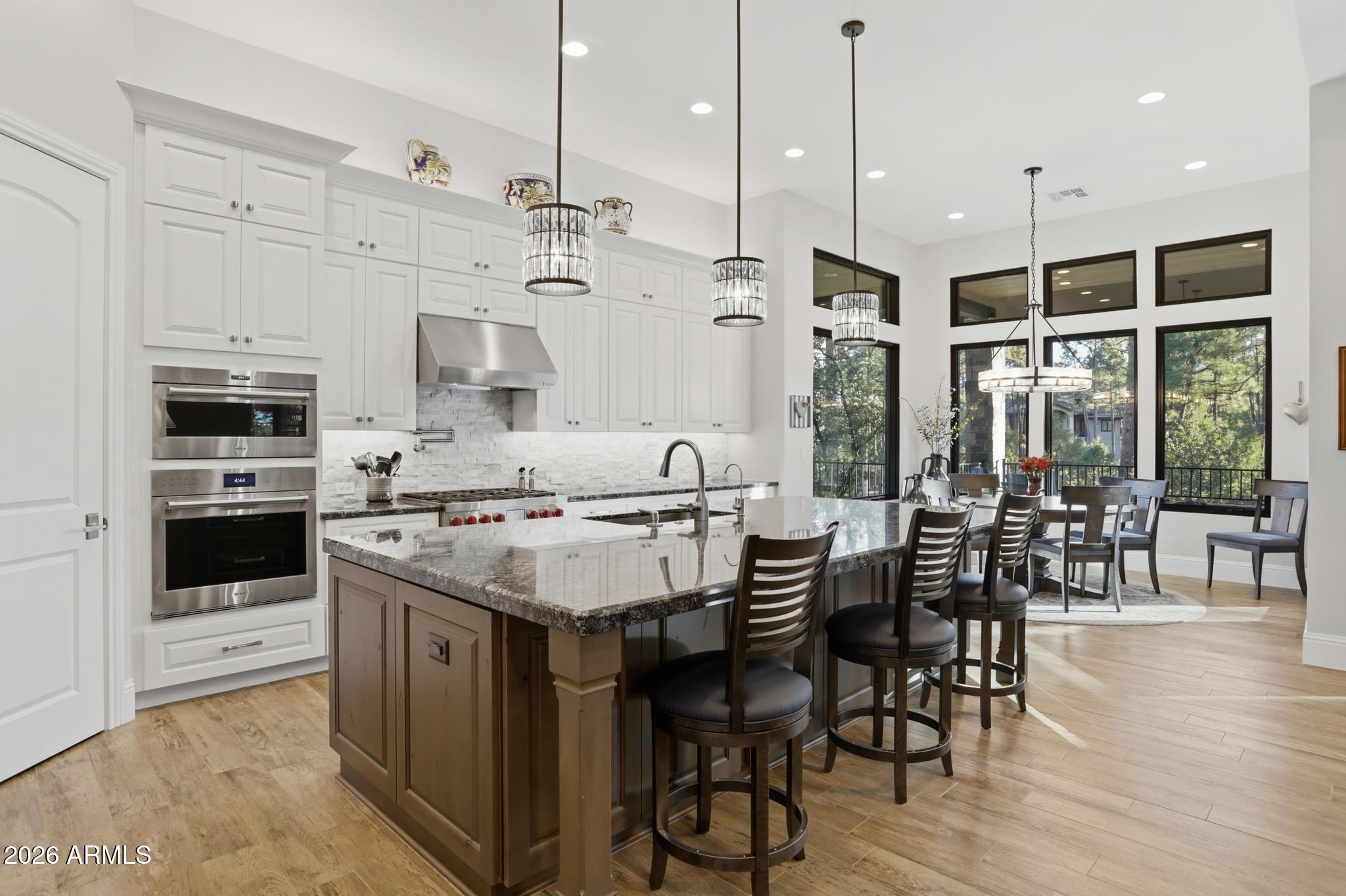 2207 East Filaree Circle Payson, AZ 85541 - Photo 7 of 38 a kitchen with stainless steel appliances kitchen island a large island in the center