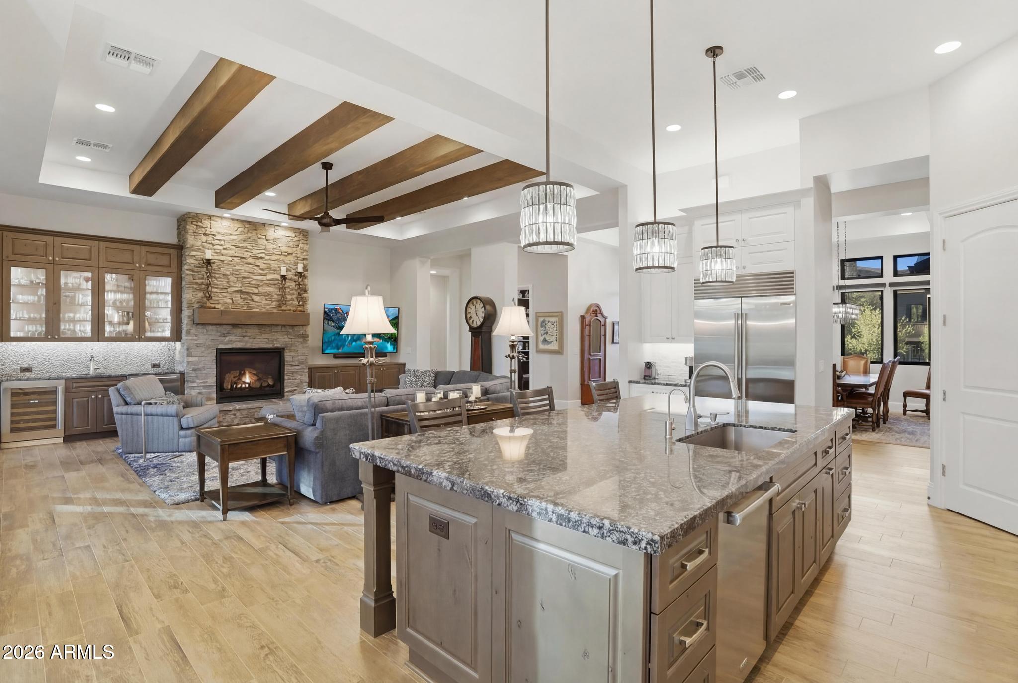 2207 East Filaree Circle Payson, AZ 85541 - Photo 9 of 38 a kitchen with granite countertop a stove and a fireplace