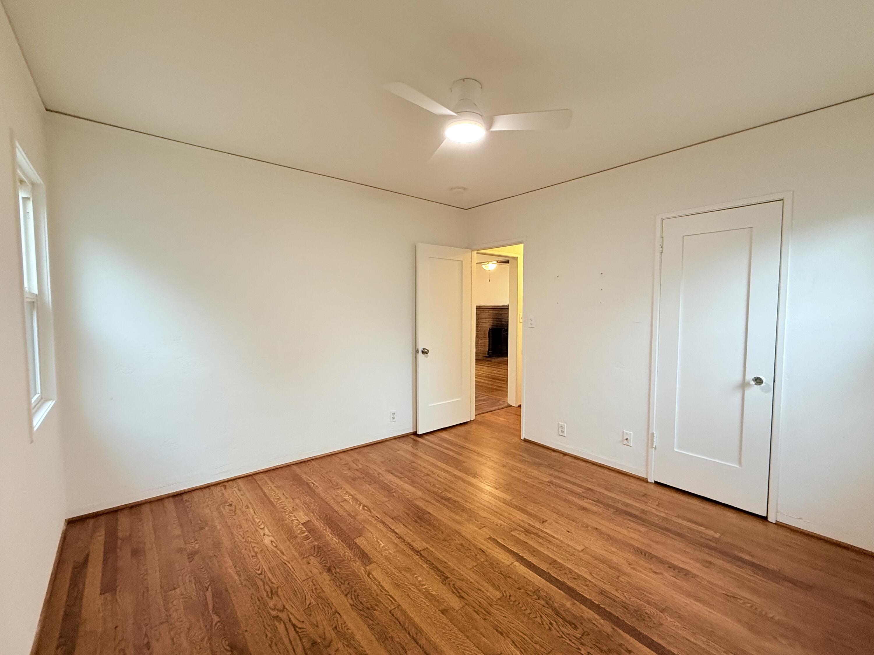 1411 Gillespie Street Santa Barbara, CA 93101 - Photo 13 of 26 a view of an empty room with wooden floor