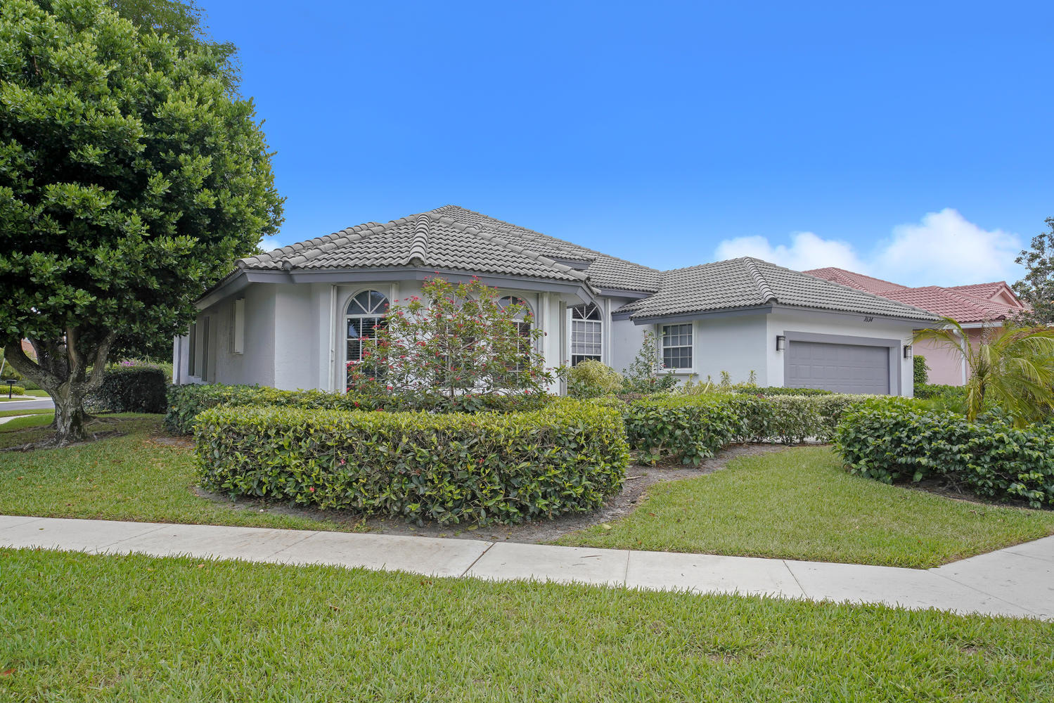 7634 La Corniche Circle Boca Raton, FL 33433 - Photo 3 of 36 SIDE/FRONT VIEW