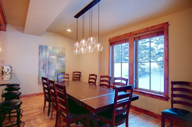 a view of a dining room with furniture window and outside view