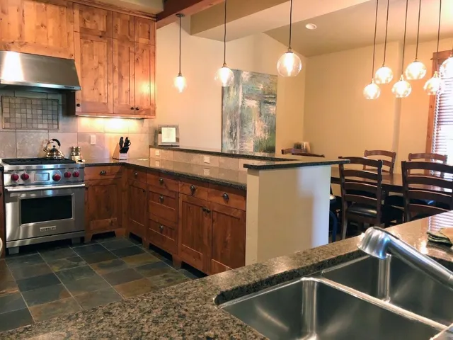 a kitchen with a sink and cabinets
