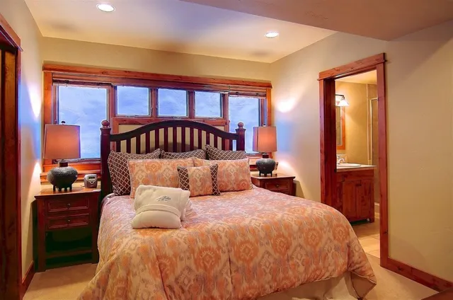 a bed room with a bed and a lamp