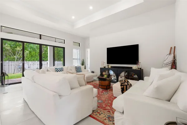 a living room with furniture and a rug