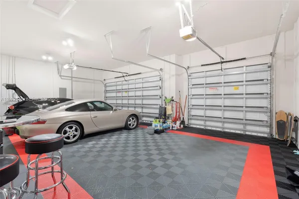 an aerial view of a residential houses with outdoor space and street view