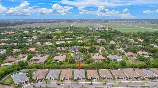 an aerial view of a house with a garden