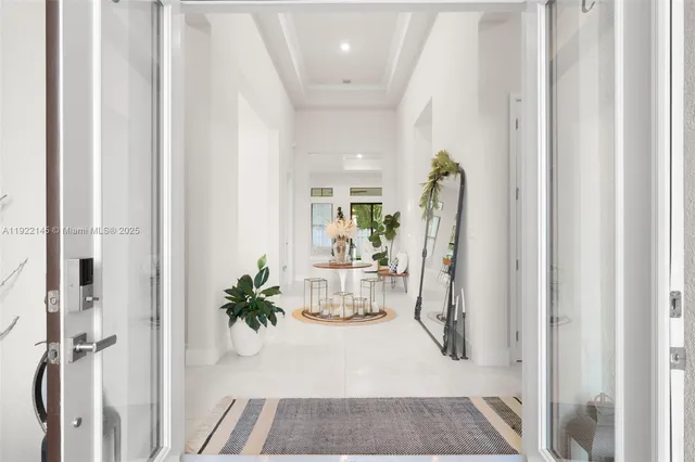 a view of a dining room with furniture wooden floor and a chandelier