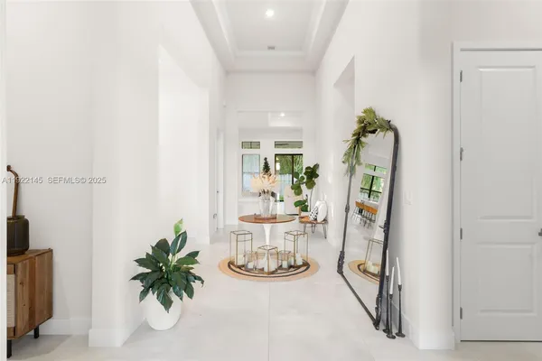 a view of a dining room with furniture wooden floor and a chandelier