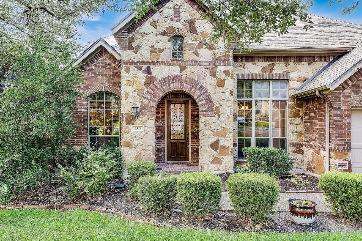 3527 Alexandrite Way Round Rock, TX 78681 - Photo 1 of 1 a front view of a house with garden