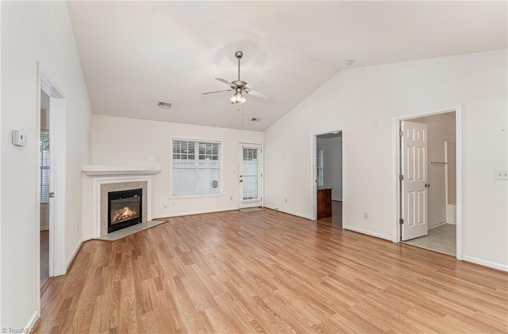 111 Castleton Drive Thomasville, NC 27360 - Photo 9 of 22 Great room with vaulted ceiling and FP
