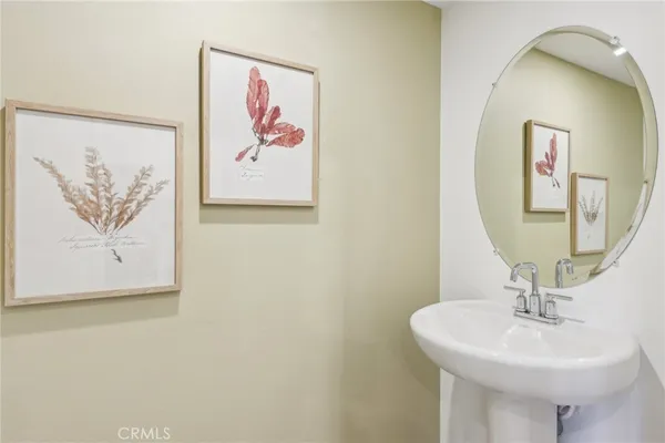 a bathroom with a sink and mirror