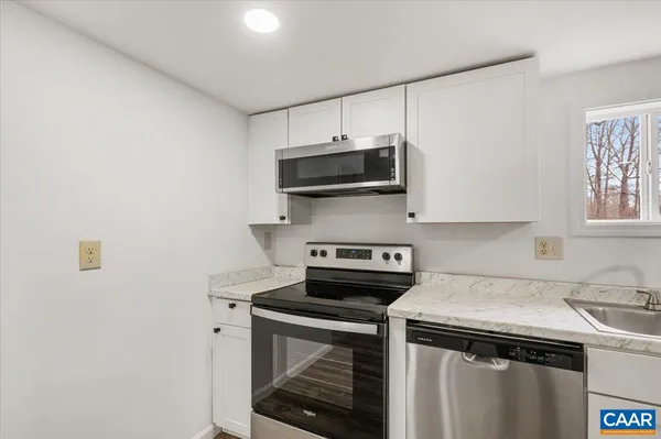 a kitchen with a stove and a microwave