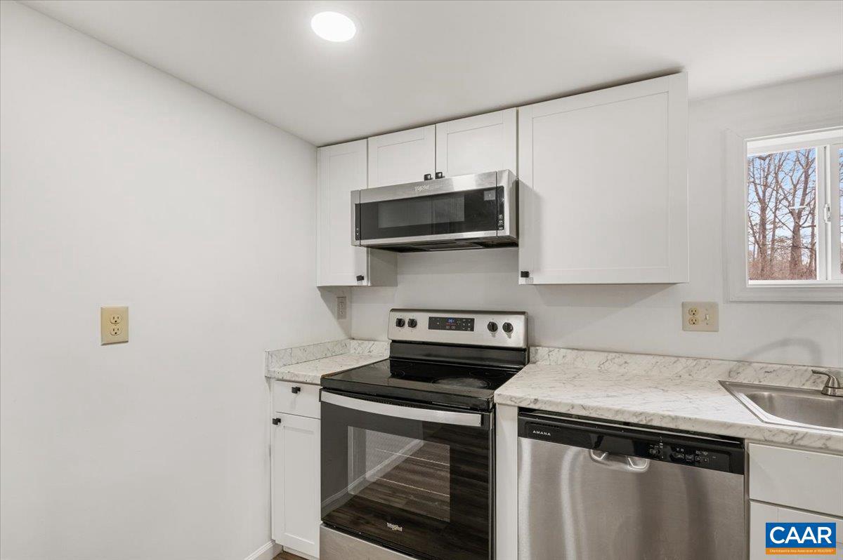 662 Celt Road Stanardsville, VA 22973 - Photo 16 of 22 a kitchen with a stove and a microwave
