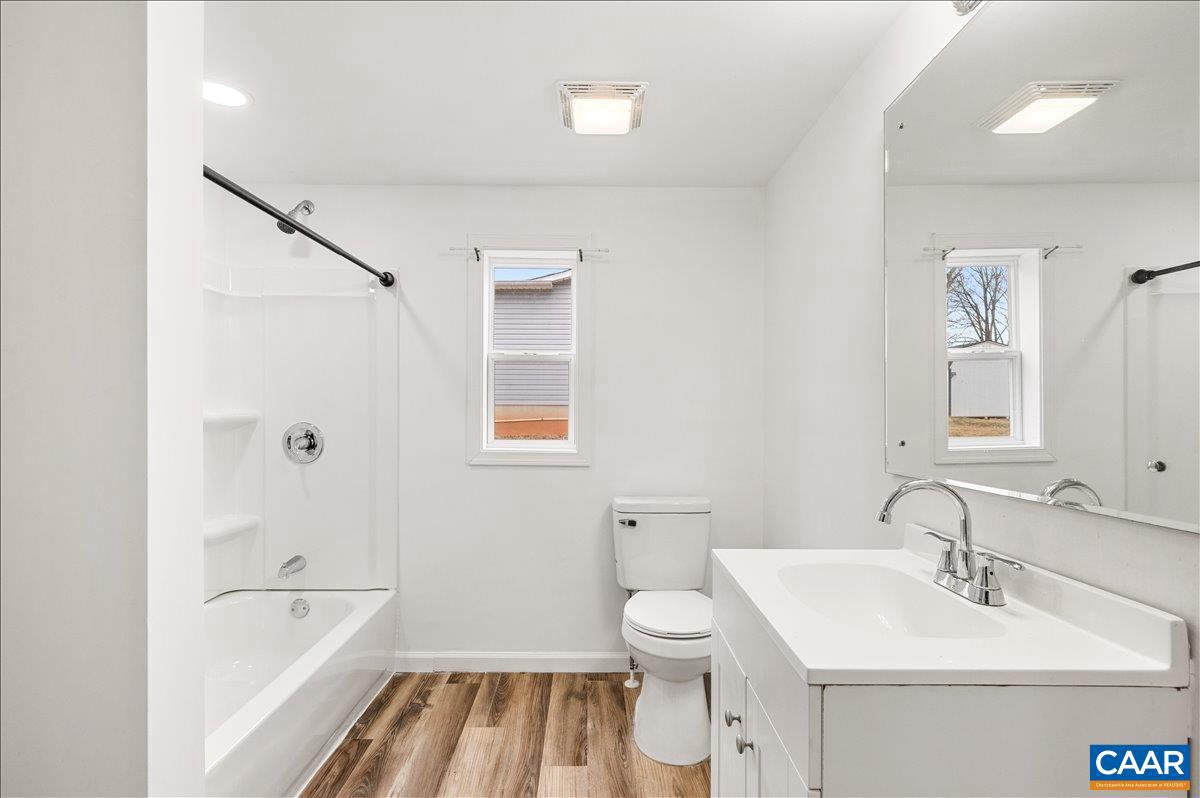 662 Celt Road Stanardsville, VA 22973 - Photo 19 of 22 a bathroom with a sink a toilet and shower