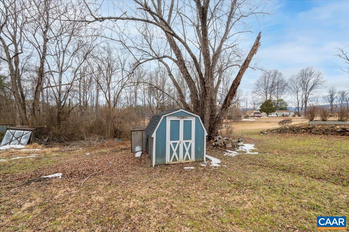 662 Celt Road Stanardsville, VA 22973 - Photo 5 of 22 a view of a yard covered with snow in the front