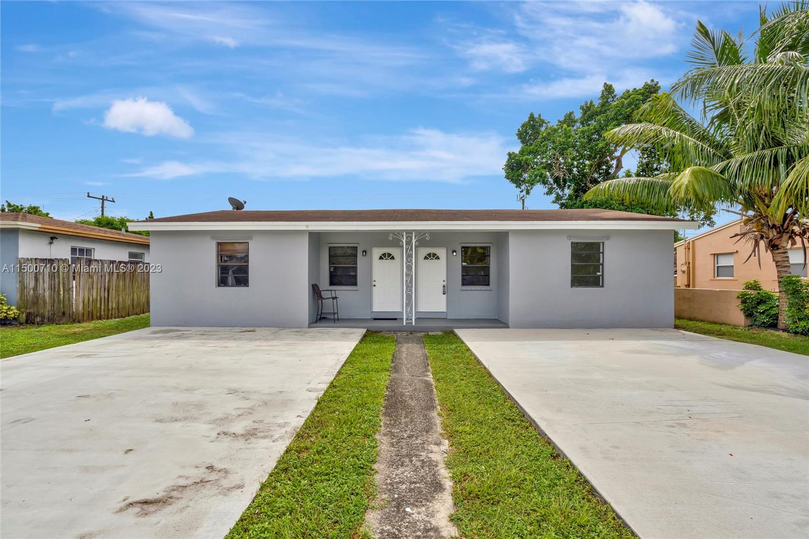 6126 Southwest 19th Street, Unit E Miramar, FL 33023 - Photo 17 of 26 a view of a house with swimming pool and a yard