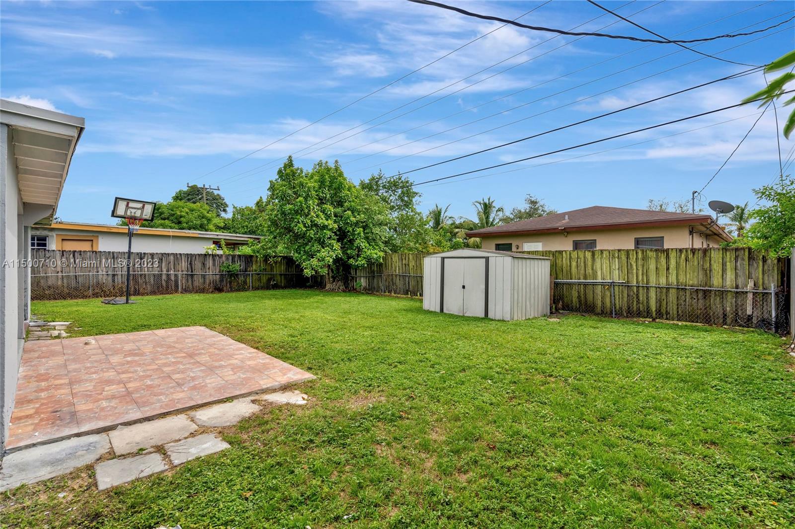 6126 Southwest 19th Street, Unit E Miramar, FL 33023 - Photo 19 of 26 a view of a house with backyard and a garden