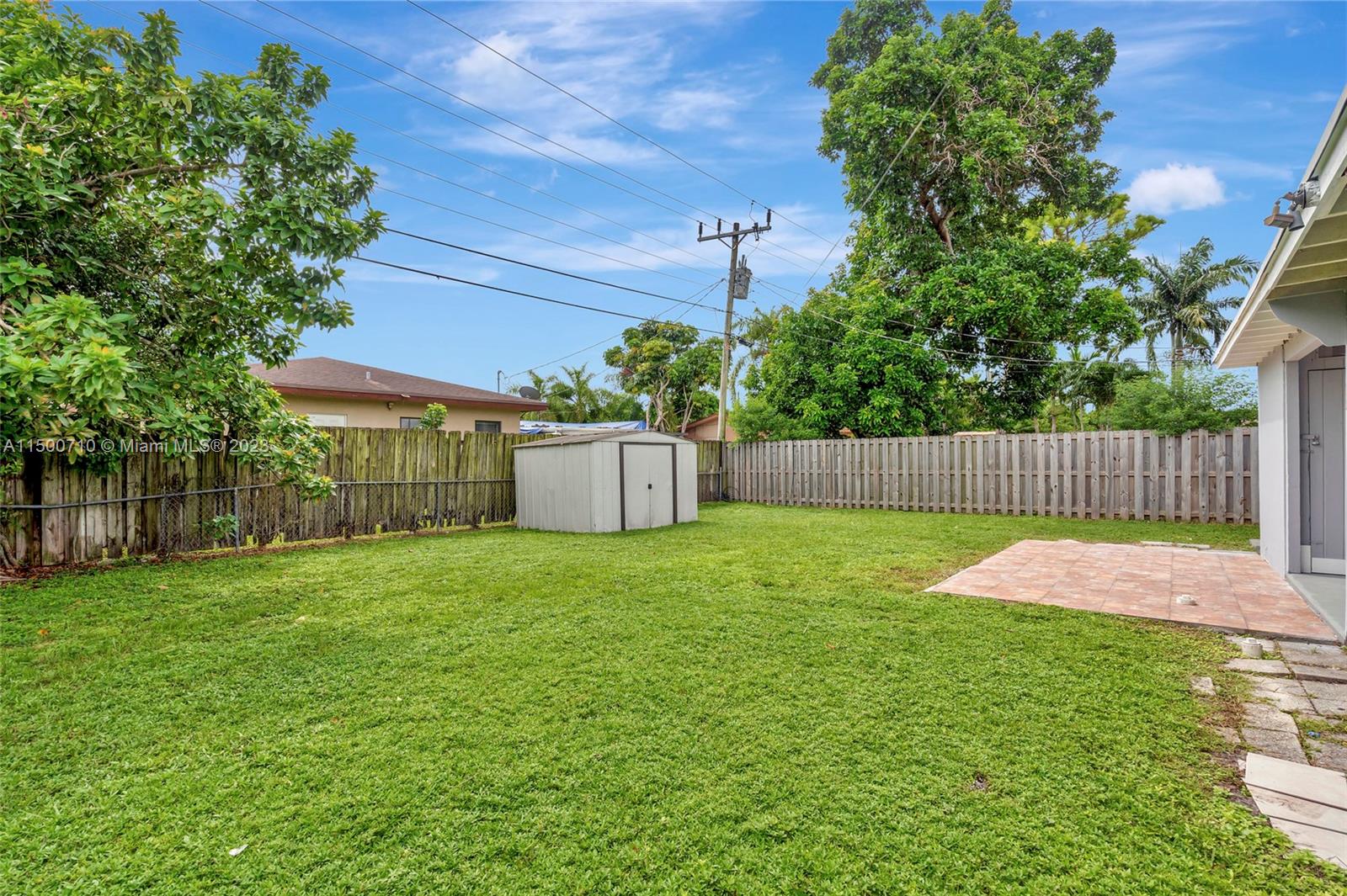 6126 Southwest 19th Street, Unit E Miramar, FL 33023 - Photo 20 of 26 a backyard of a house with lots of green space