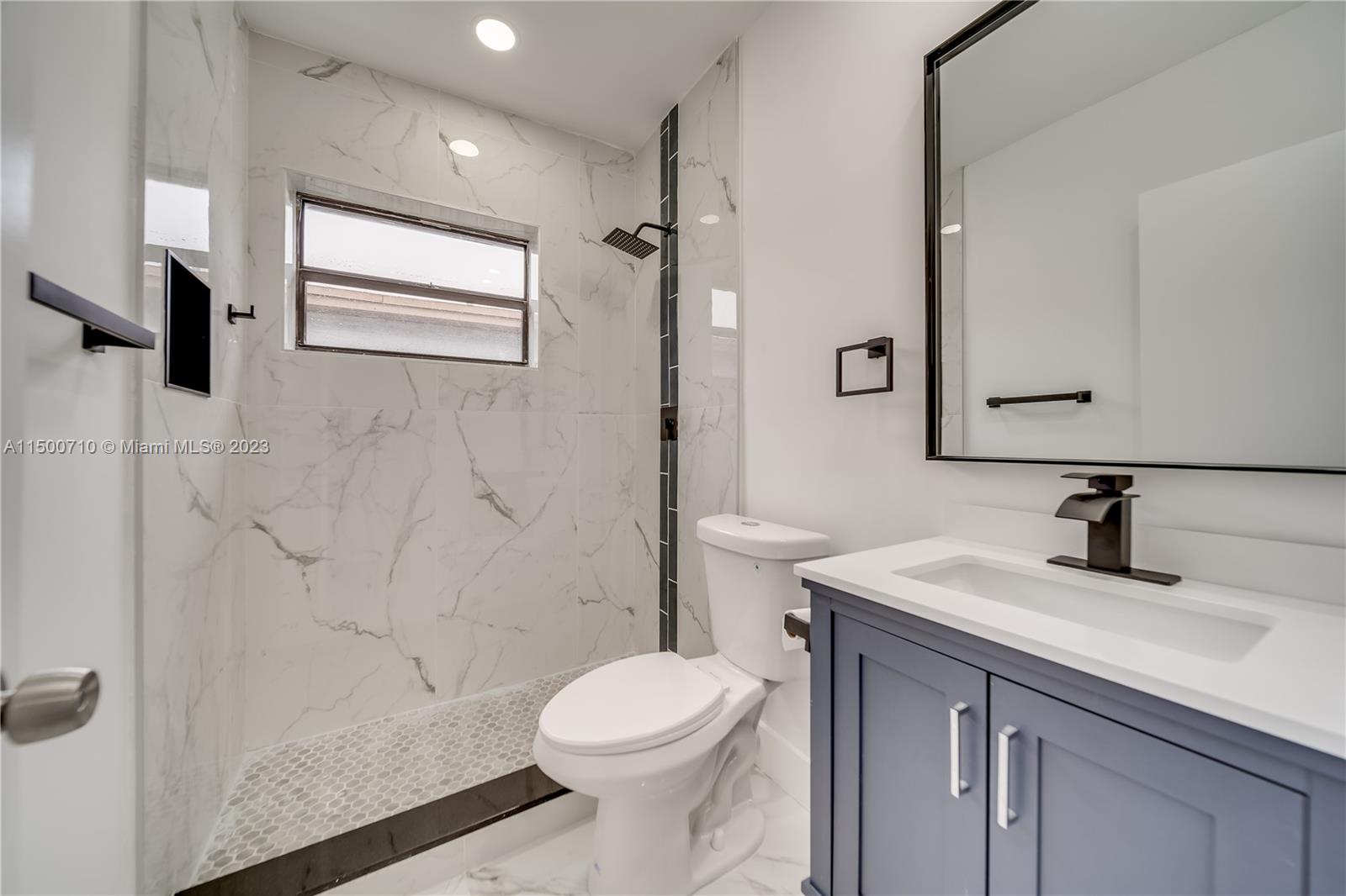 6126 Southwest 19th Street, Unit E Miramar, FL 33023 - Photo 9 of 26 a bathroom with a sink toilet and shower