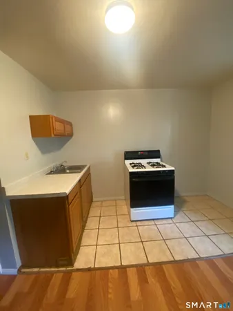 a kitchen with a stove and a microwave