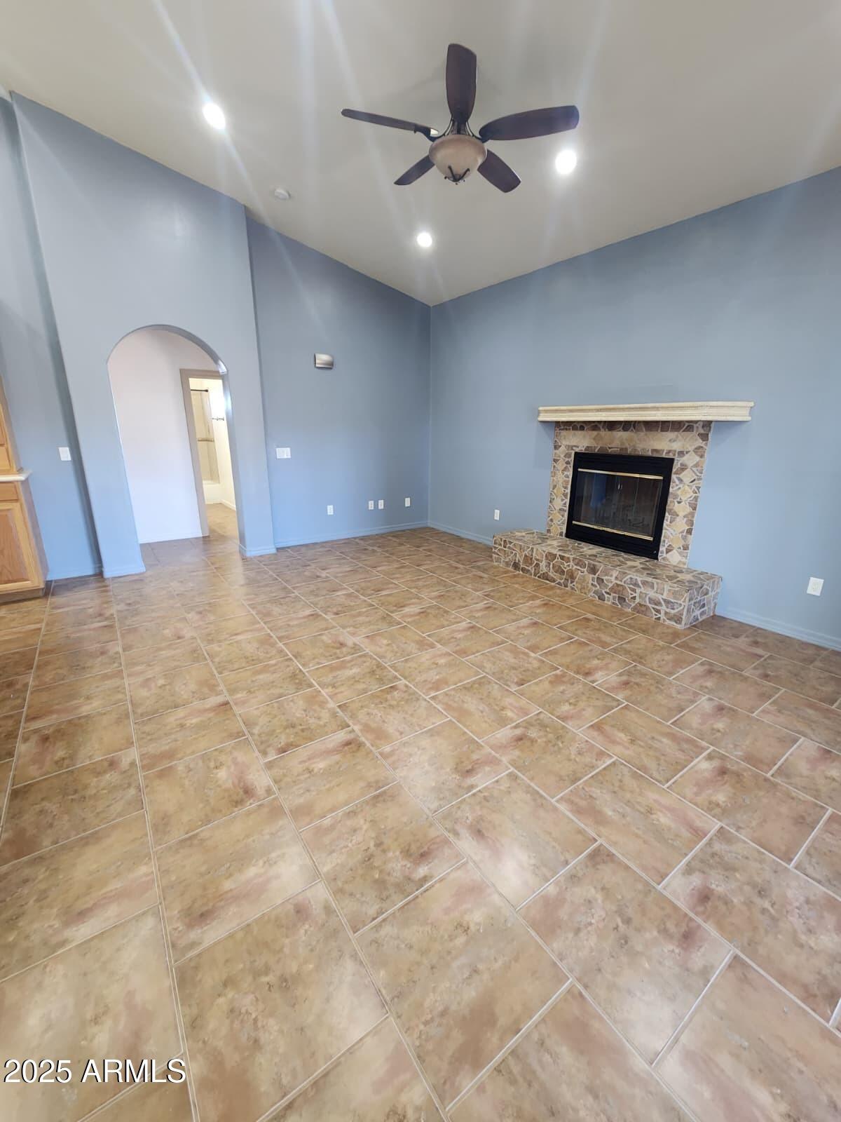 1766 East Golf Course Road Douglas, AZ 85607 - Photo 13 of 29 a view of an empty room with a fireplace