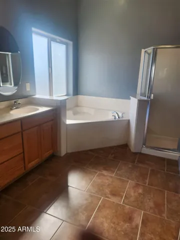 a bathroom with a glass door shower and toilet