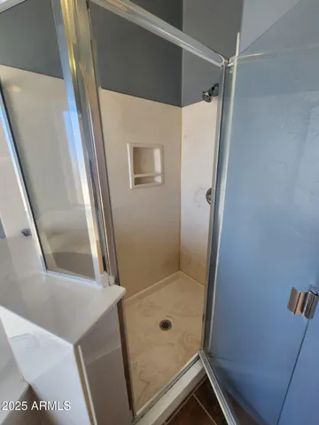 a bathroom with a bathtub and a window