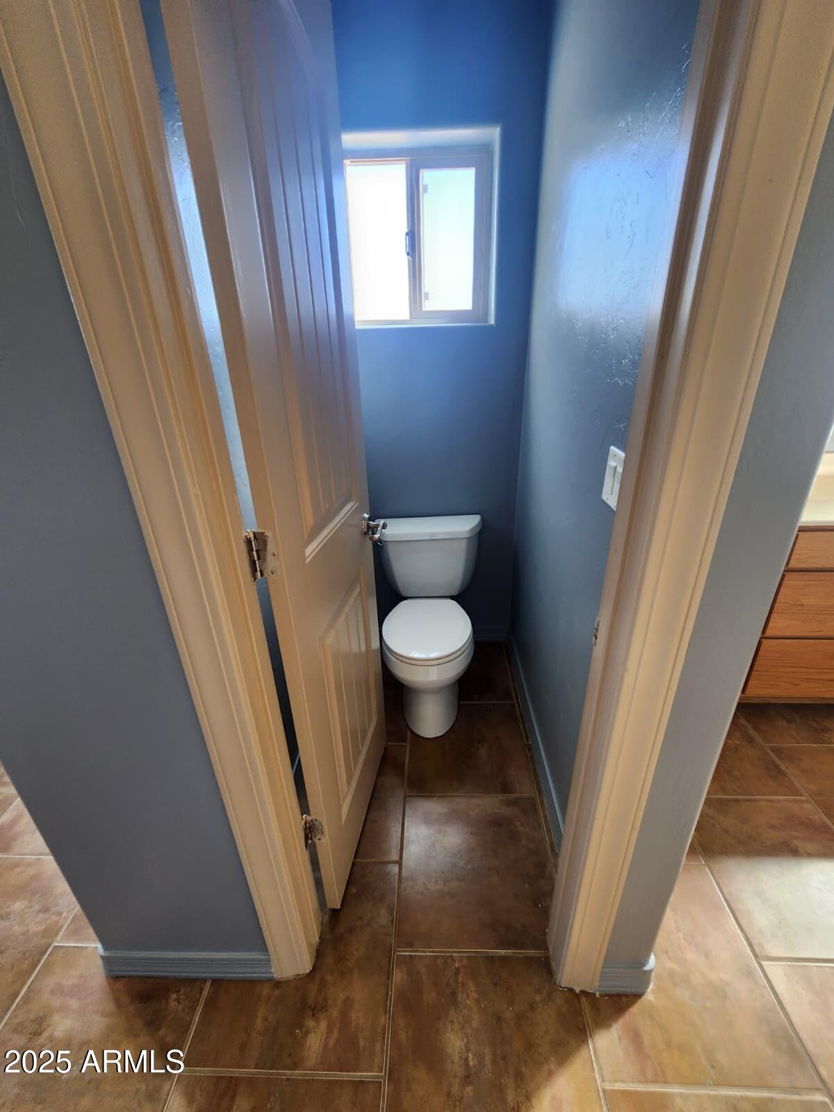 1766 East Golf Course Road Douglas, AZ 85607 - Photo 28 of 29 a bathroom with a sink and a toilet