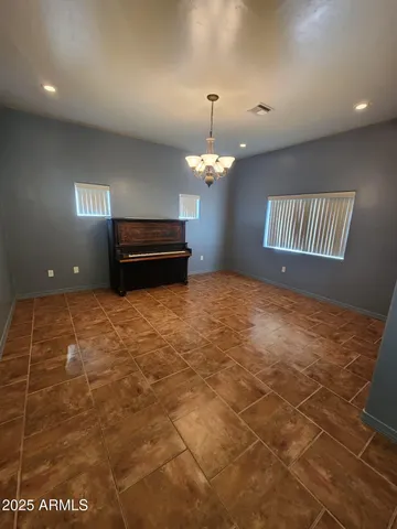 a large kitchen with kitchen island granite countertop a sink and a stove